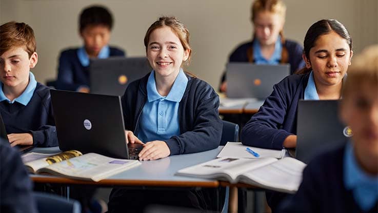 School girl sitting in classroom