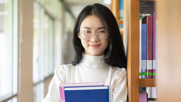 tertiary student in library