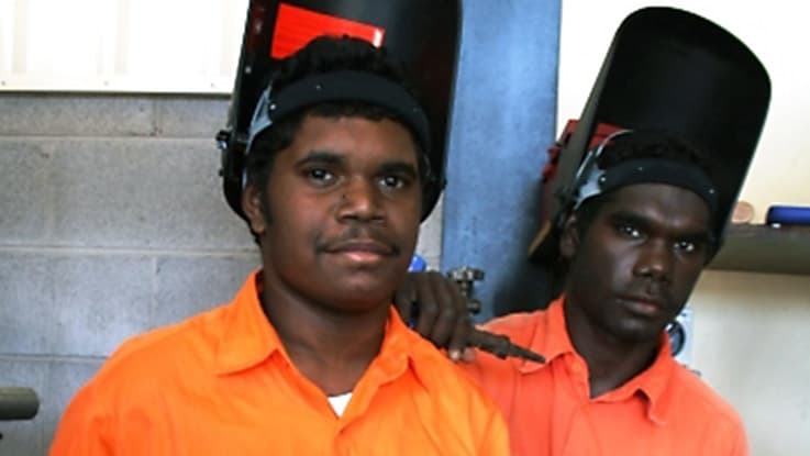 Students learning welding