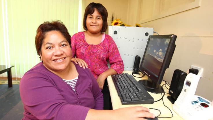 Mother and daughter in front of a computer in the Gold Coast